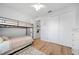 Bedroom featuring bunk beds, light wood flooring, and closet at 2366 Ann Arbor Rd, North Port, FL 34286
