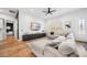 Comfortable living room boasts a large sectional sofa, sleek entertainment center, and stylish accents at 2366 Ann Arbor Rd, North Port, FL 34286