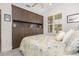 Comfortable bedroom with custom built-in storage and lots of natural light at 2705 Taheebo Way, North Port, FL 34289