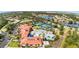 Overhead image showcasing the clubhouse, pool, tennis courts, and community garden at 2705 Taheebo Way, North Port, FL 34289