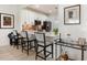Charming kitchen featuring white cabinets, pendant lighting, and a breakfast bar at 2705 Taheebo Way, North Port, FL 34289