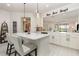 Bright kitchen with a large island with counter seating, pendant lighting, and an open floor plan at 2705 Taheebo Way, North Port, FL 34289