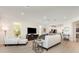 Open-concept living room that flows into the kitchen, featuring modern decor and comfortable seating at 2705 Taheebo Way, North Port, FL 34289