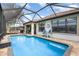 Sparkling pool in screened lanai with outdoor dining and seating areas for relaxing or entertaining at 2705 Taheebo Way, North Port, FL 34289