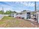 Spacious backyard featuring grass, an outdoor storage area, and a screened lanai at 2715 52Nd Avenue W Ter, Bradenton, FL 34207