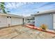 Exterior view showcasing the home's back, including a screened lanai, garage, and potted plants at 2715 52Nd Avenue W Ter, Bradenton, FL 34207