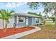 Cozy single-story home with manicured front yard, vibrant mulch and sidewalk path at 2715 52Nd Avenue W Ter, Bradenton, FL 34207