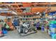 Spacious garage with exposed wood beams and ceiling, lots of storage, and room for projects at 2715 52Nd Avenue W Ter, Bradenton, FL 34207