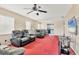 Open-concept living room with comfortable seating, ceiling fan, and easy access to the kitchen at 2715 52Nd Avenue W Ter, Bradenton, FL 34207