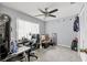 Well-lit home office featuring tile floors, a desk, and a ceiling fan at 2715 52Nd Avenue W Ter, Bradenton, FL 34207