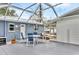 Outdoor patio with screened enclosure and patio furniture, adjacent to the home at 2715 52Nd Avenue W Ter, Bradenton, FL 34207