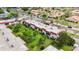 Aerial view of the condo complex with mature trees and lush lawns at 3500 Beneva Rd # 306, Sarasota, FL 34232