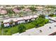 Aerial view of the condo complex with mature trees, community pool and lush lawns at 3500 Beneva Rd # 306, Sarasota, FL 34232