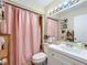 Bathroom featuring a shower, vanity, toilet, and mirror to maximize space and add convenience at 3500 Beneva Rd # 306, Sarasota, FL 34232