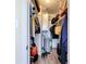 Walk in closet with closet organizer and water heater at 3500 Beneva Rd # 306, Sarasota, FL 34232