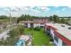 Exterior view of building with pool and green spaces at 3500 Beneva Rd # 306, Sarasota, FL 34232