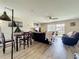 Spacious living room featuring wood floors, a ceiling fan, and a sliding glass door to bring in plenty of light at 3500 Beneva Rd # 306, Sarasota, FL 34232