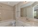 Bathroom with tub and shower, sink, and vanity at 3530 Adelaide Ave, North Port, FL 34288