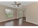 Bedroom features include hardwood floors, ceiling fan, window, and sliding closet door at 3530 Adelaide Ave, North Port, FL 34288