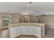 Open kitchen view showcasing the breakfast bar and connecting living space at 3530 Adelaide Ave, North Port, FL 34288