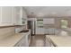 Well-lit kitchen featuring stainless steel appliances and an eat-in breakfast bar at 3530 Adelaide Ave, North Port, FL 34288