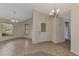 Bright and spacious living room featuring neutral paint, tile floors and ample natural light at 3530 Adelaide Ave, North Port, FL 34288