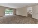 Open-concept living room leading to outdoor pool area at 3530 Adelaide Ave, North Port, FL 34288