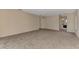 Spacious living room with neutral carpeting at 3530 Adelaide Ave, North Port, FL 34288