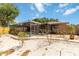 Manicured backyard with a screened-in pool area and lush landscaping at 3600 Aster Dr, Sarasota, FL 34233