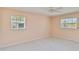 This cozy bedroom gets ample natural light from two large windows at 3600 Aster Dr, Sarasota, FL 34233