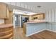 Eat-in kitchen featuring oak cabinetry, ceiling fan and stainless steel appliances at 3600 Aster Dr, Sarasota, FL 34233