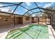 Inviting pool offers a screened enclosure with a tile surround and privacy at 3600 Aster Dr, Sarasota, FL 34233