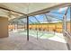 Enclosed pool features a screened lanai, a concrete patio, and a wood fence at 3600 Aster Dr, Sarasota, FL 34233