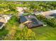 An aerial view of the property showcasing the pool, lanai, and landscaping at 3941 Spyglass Hill Rd, Sarasota, FL 34238