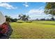 Expansive backyard offering scenic views of the community golf course at 3941 Spyglass Hill Rd, Sarasota, FL 34238
