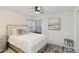 Bedroom with natural light, neutral decor, side table and bench stool at 3941 Spyglass Hill Rd, Sarasota, FL 34238