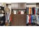 Walk-in closet featuring custom organization with shelving, drawers, hanging rods, and accessories at 3941 Spyglass Hill Rd, Sarasota, FL 34238