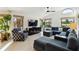 Bright and airy living room with a sectional sofa, contemporary furnishings, and large windows offering scenic views at 3941 Spyglass Hill Rd, Sarasota, FL 34238