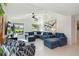 Comfortable living room featuring a large sectional sofa, bright natural light, and modern decor, perfect for relaxation at 3941 Spyglass Hill Rd, Sarasota, FL 34238