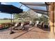 Screened patio with lounge chairs and a view of the lush golf course, offers a relaxing outdoor space at 3941 Spyglass Hill Rd, Sarasota, FL 34238