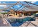 Inviting screened-in pool area with ample seating and dining space, creating an ideal outdoor entertainment setting at 3941 Spyglass Hill Rd, Sarasota, FL 34238