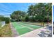 Community bocce ball court surrounded by mature landscaping and beautiful trees at 400 Laurel Lake Dr # 104, Venice, FL 34292