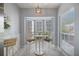 Cozy breakfast nook with large bay window and comfortable seating at 400 Laurel Lake Dr # 104, Venice, FL 34292