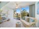 Cozy den space features waterfront views, bright natural light, and serene coastal decor at 400 Laurel Lake Dr # 104, Venice, FL 34292