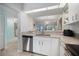 Contemporary kitchen with stainless steel dishwasher and ample counter space at 400 Laurel Lake Dr # 104, Venice, FL 34292