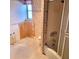 Outdated bathroom featuring a bathtub with sliding doors and peach floral wallpaper needing remodel at 435 S Gulfstream Ave # 605, Sarasota, FL 34236