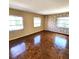 Bright bedroom featuring parquet floors and three windows offering lots of natural light at 435 S Gulfstream Ave # 605, Sarasota, FL 34236