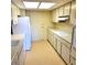 Functional kitchen featuring classic white cabinetry, ample counter space, and essential appliances at 435 S Gulfstream Ave # 605, Sarasota, FL 34236