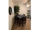 Cozy dining area with a modern table set, decorative greenery, and a ceiling fan at 4502 3Rd Street W Cir # 242, Bradenton, FL 34207