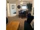 Open-concept living room with a dining area, cozy seating, and a ceiling fan for comfortable living at 4502 3Rd Street W Cir # 242, Bradenton, FL 34207